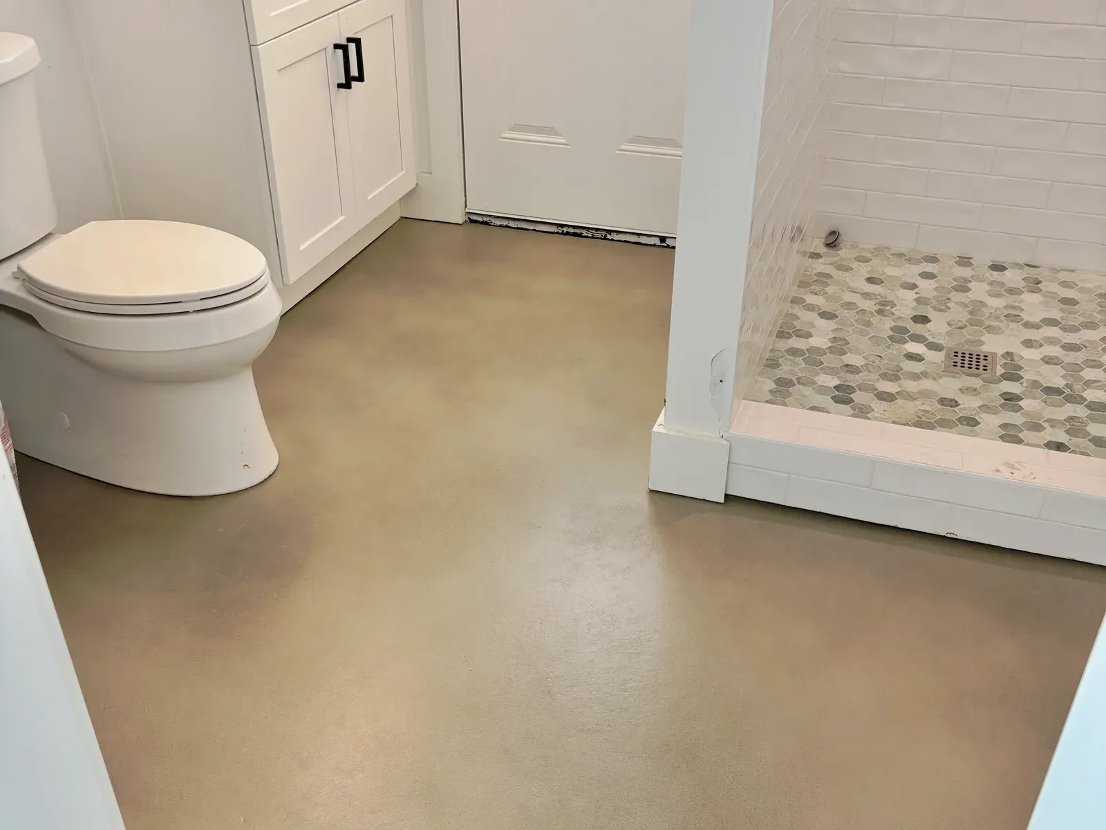 Stained concrete bathroom floor by JP Concrete Creations in metro Atlanta
