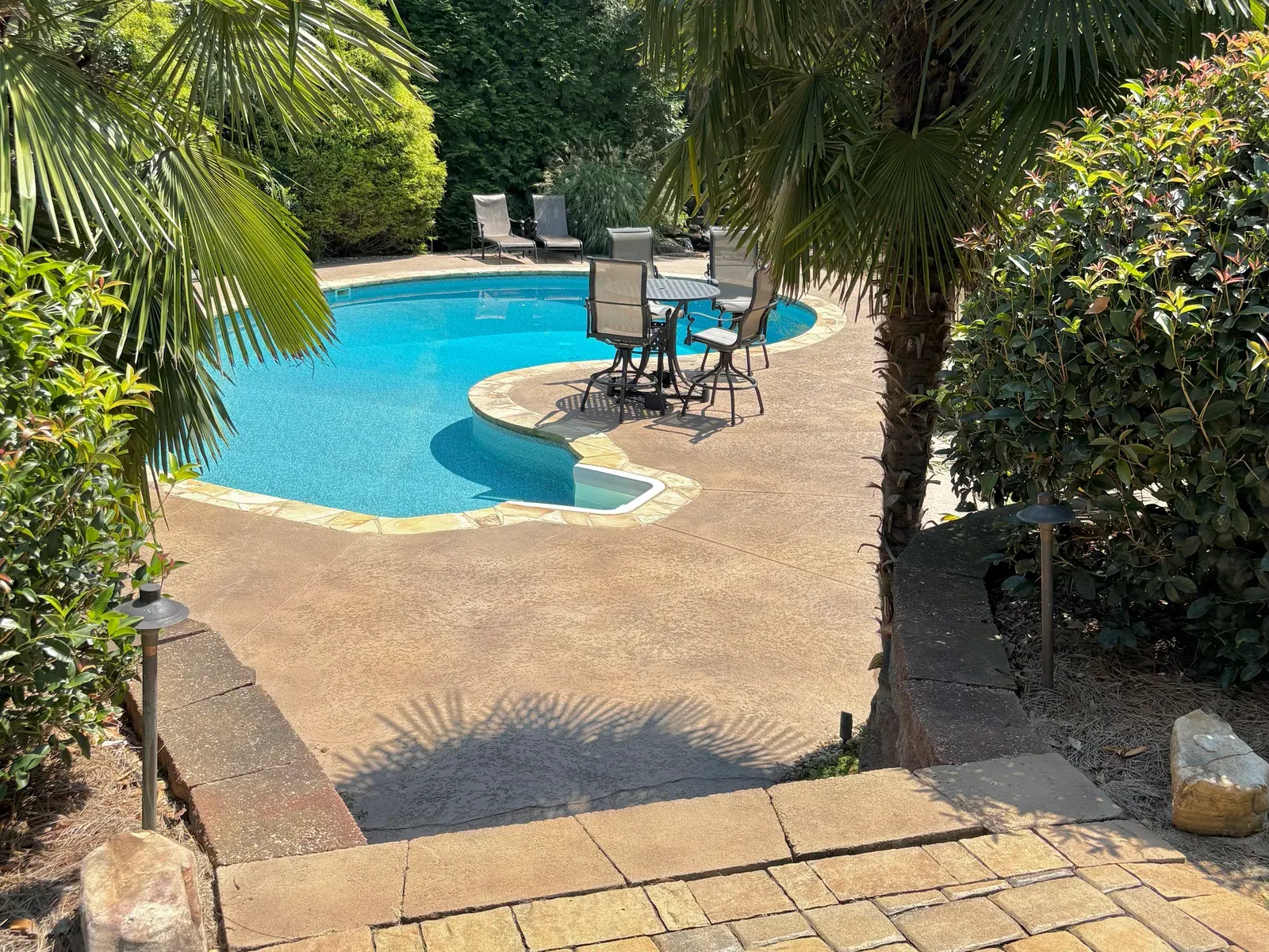 Stained concrete pool deck by JP Concrete Creations in metro Atlanta