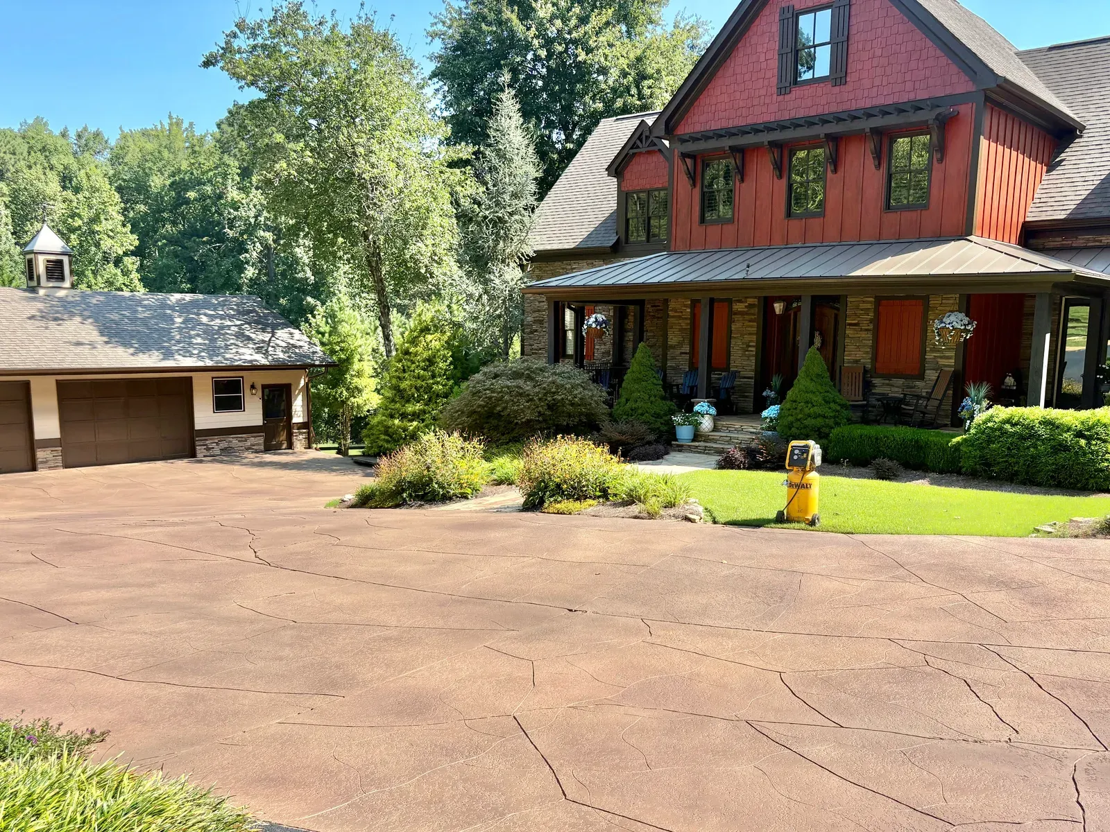 Stained concrete driveway with a cut stone pattern by JP Concrete Creations in Georgia