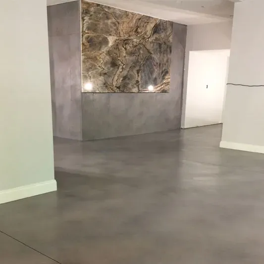 James Peters applying a decorative concrete finish on a residential surface