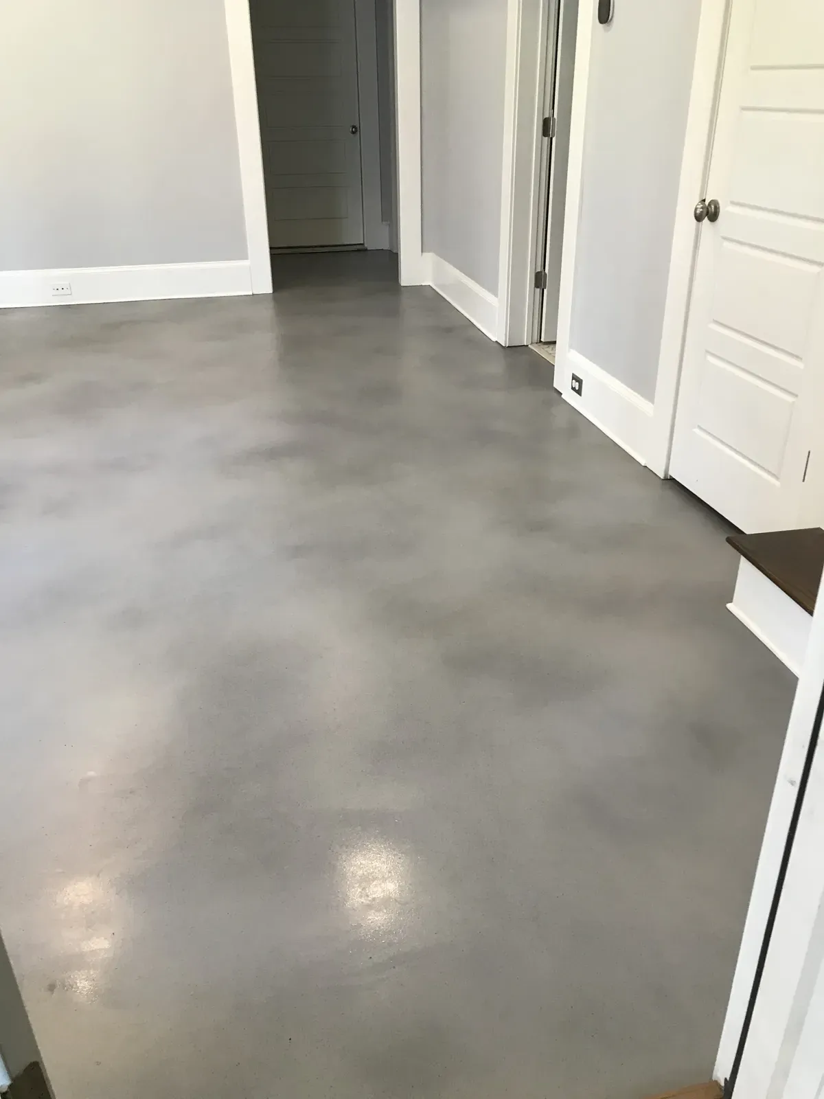 Neutral gray stained concrete interior floor in an Atlanta home