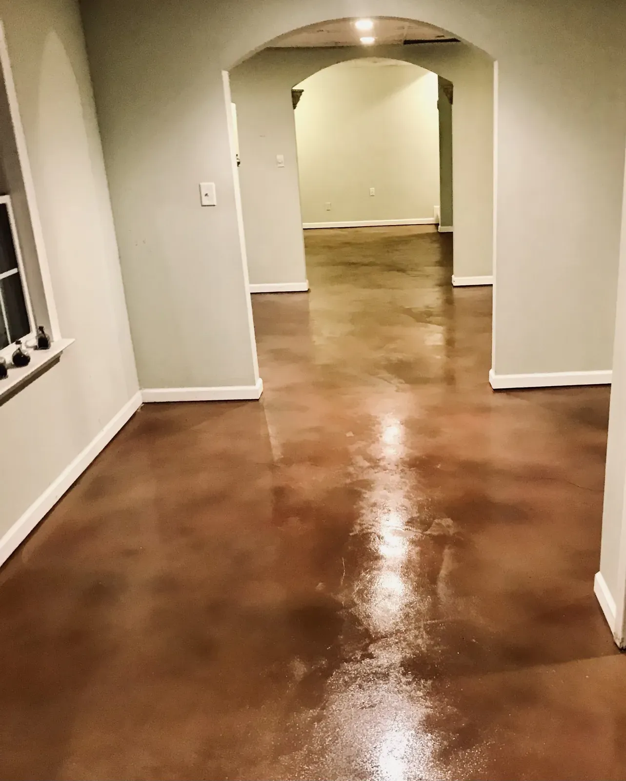 Stained concrete interior floor with rich custom color by JP Concrete Creations