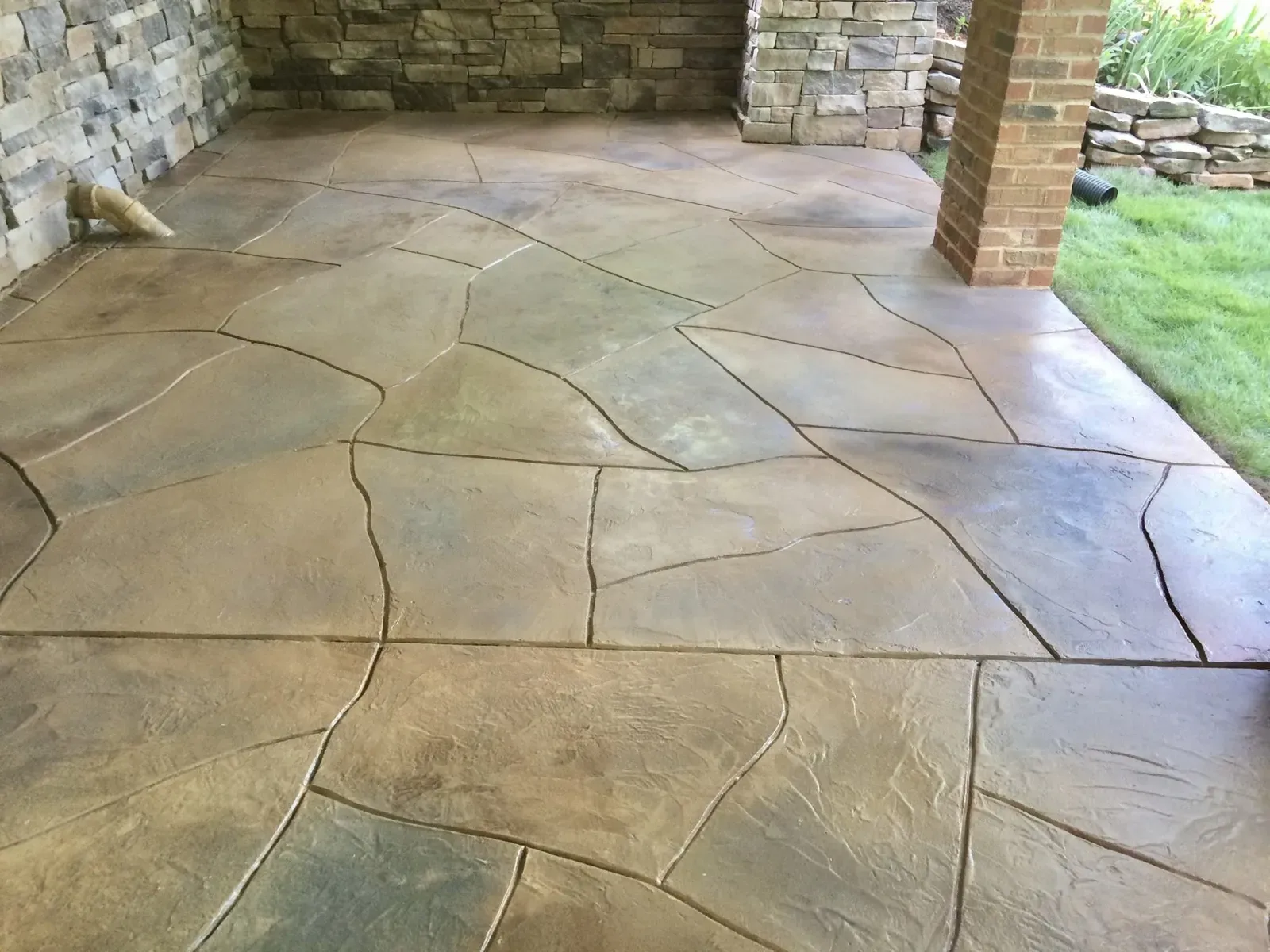 Stamped concrete overlay patio with a random flagstone pattern by JP Concrete Creations in metro Atlanta